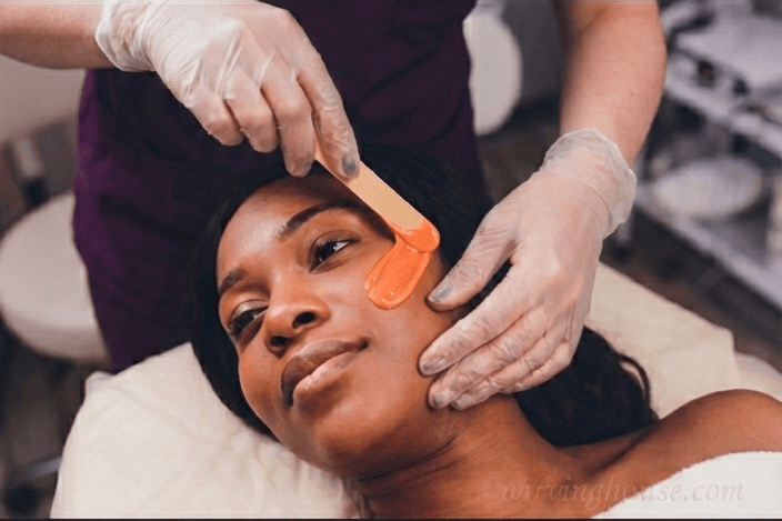 Precision facial waxing treatment - eyebrow, lip, and chin hair removal by licensed esthetician